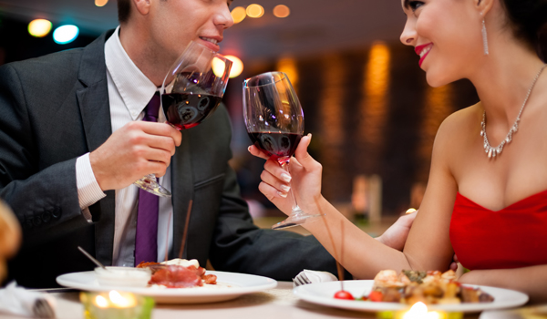 25569069-xxl-hands-of-couple-toasting-their-wine-glasses-over-a-restaurant-table-during-a-romantic-dinner.jpg